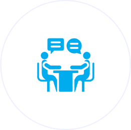 Two people talking at a table icon.